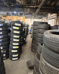 Stacks of new tyres stored in a workshop